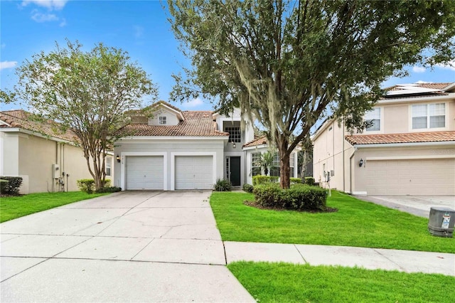 mediterranean / spanish house with a front yard