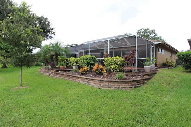 view of yard featuring glass enclosure