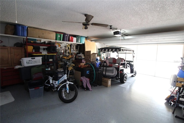 garage featuring ceiling fan and a garage door opener