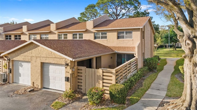 multi unit property featuring a garage