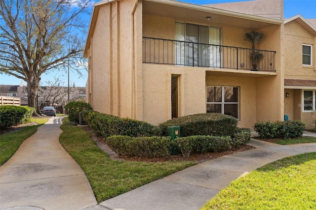 view of property exterior with a balcony