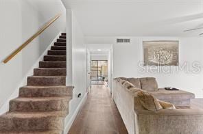 stairs with hardwood / wood-style flooring