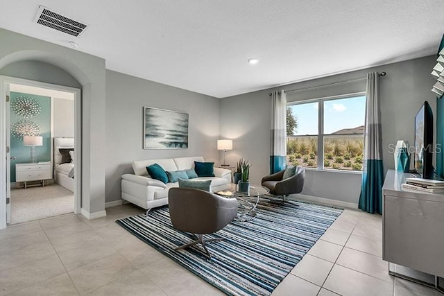 living room with light tile patterned flooring