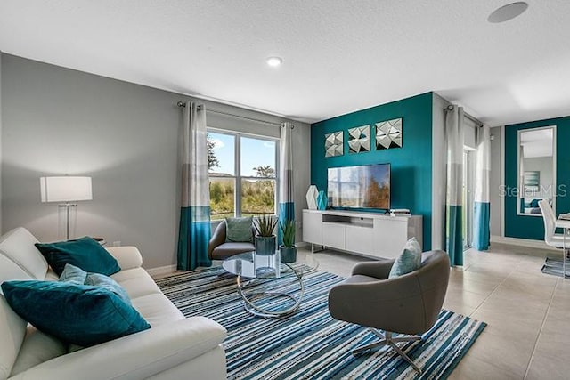 tiled living room with a textured ceiling