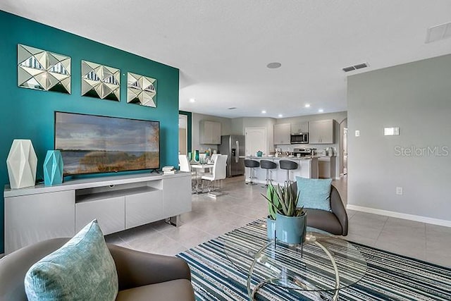 living room with light tile patterned floors