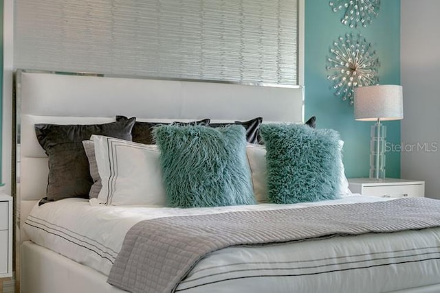 bedroom with a notable chandelier