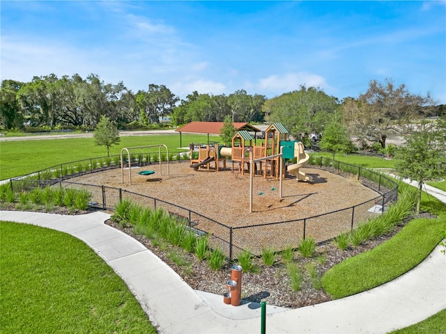 view of playground featuring a lawn