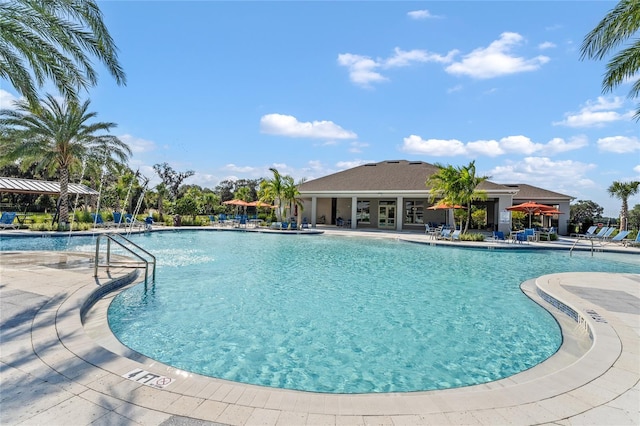 view of swimming pool with a patio