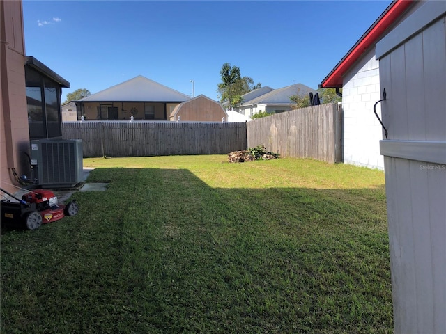 view of yard with central air condition unit