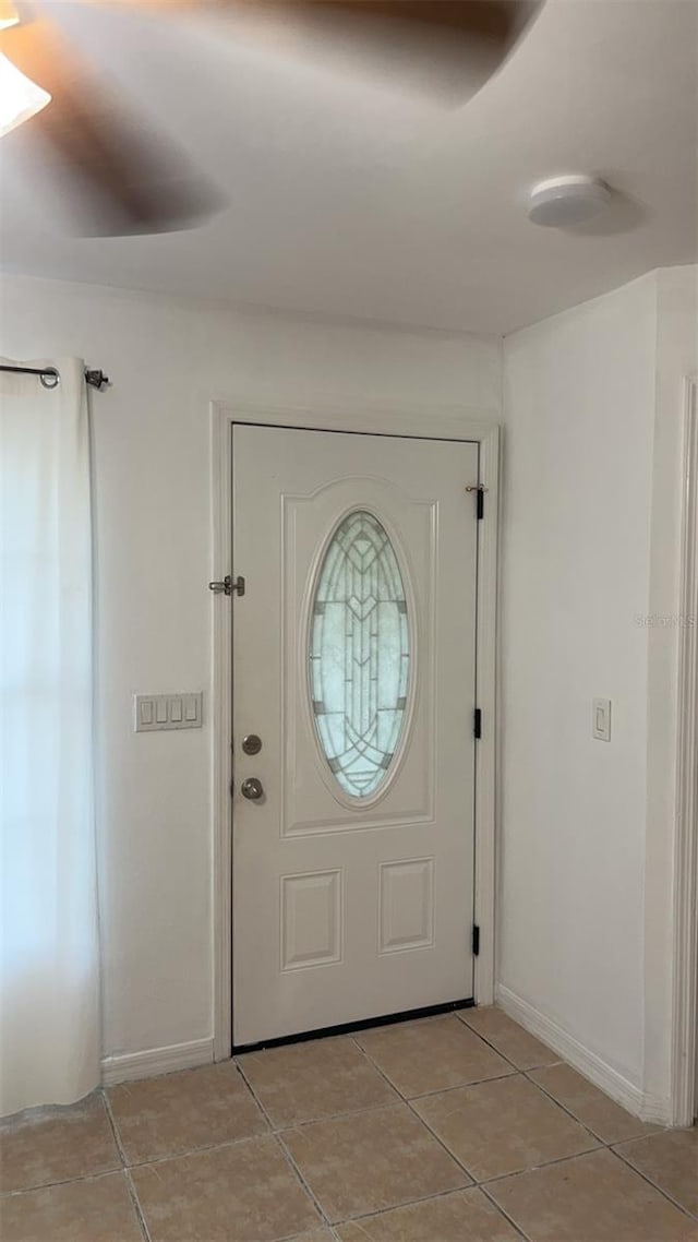 foyer with light tile patterned flooring