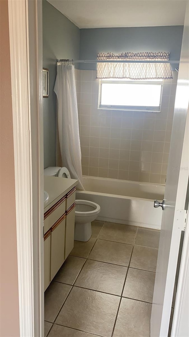 full bathroom featuring vanity, shower / tub combo with curtain, toilet, and tile patterned flooring