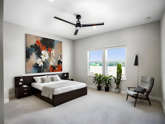 bedroom with light colored carpet and ceiling fan