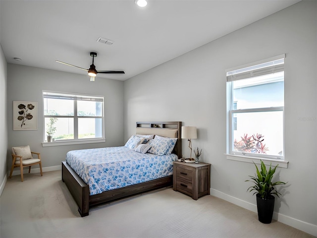 bedroom featuring ceiling fan and light colored carpet