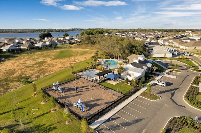 birds eye view of property with a water view