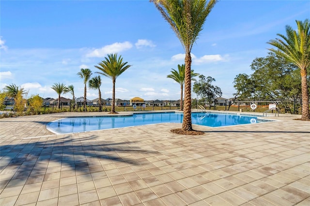 view of swimming pool with a patio