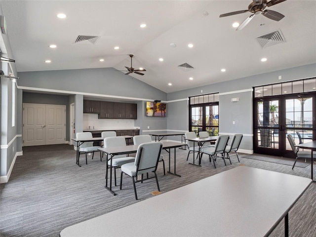 dining room with ceiling fan, french doors, and lofted ceiling