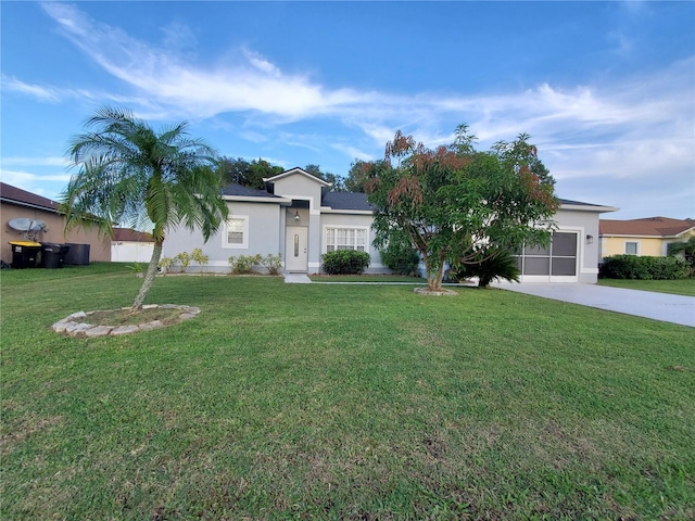 single story home featuring a garage and a front yard