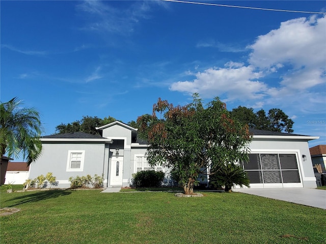 ranch-style house featuring a garage and a front yard