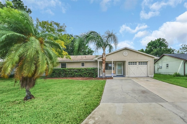 single story home featuring a garage and a front yard