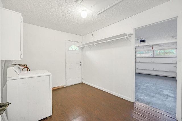 washroom with washer / dryer, a textured ceiling, and dark hardwood / wood-style floors