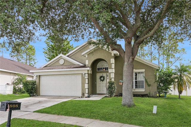 view of front facade with a front lawn and a garage