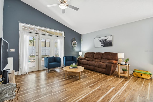 living room with french doors, ceiling fan, vaulted ceiling, and hardwood / wood-style floors