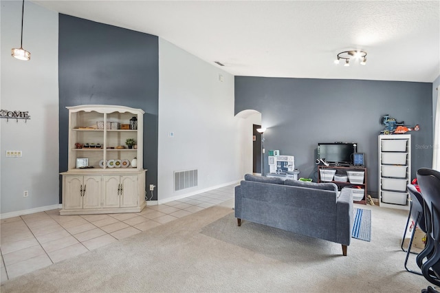 living room featuring light carpet and high vaulted ceiling