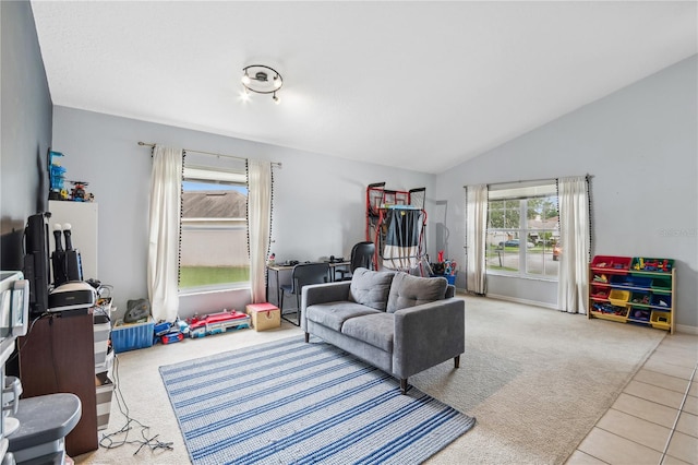 living room featuring lofted ceiling and light tile patterned flooring