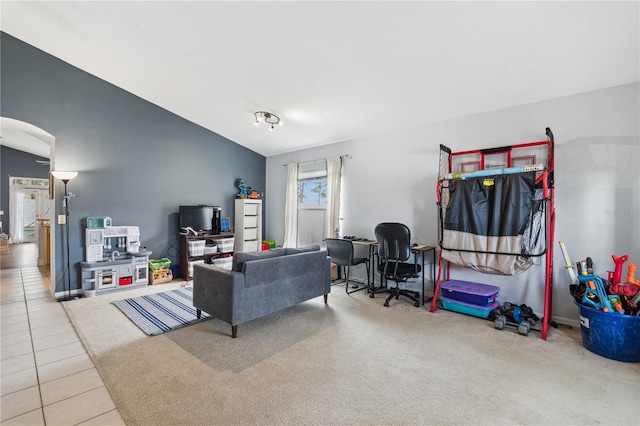 living room with vaulted ceiling and carpet floors