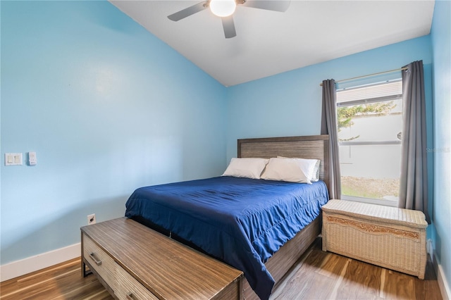 bedroom featuring vaulted ceiling, wood-type flooring, and ceiling fan