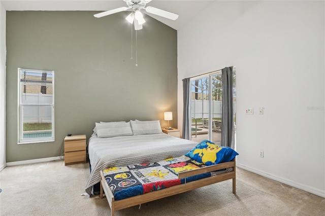 carpeted bedroom featuring ceiling fan, high vaulted ceiling, and access to exterior