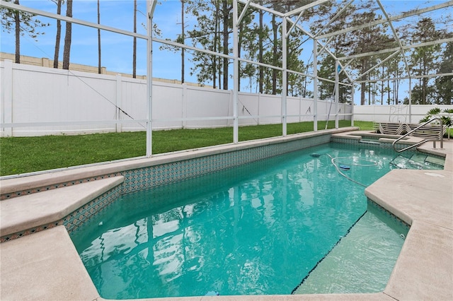 view of swimming pool with a patio and a lanai