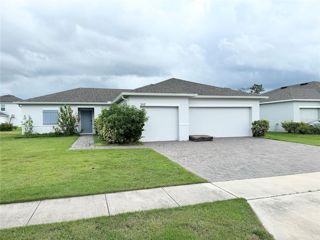 ranch-style home with a garage and a front yard