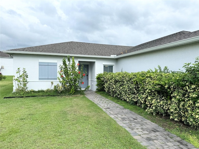 view of front of home with a front lawn