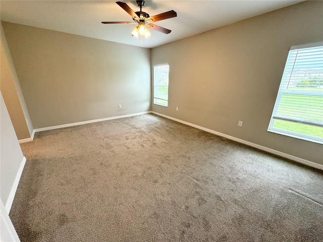 carpeted empty room with ceiling fan