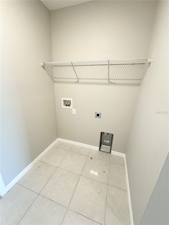 laundry area featuring washer hookup, tile patterned flooring, and electric dryer hookup