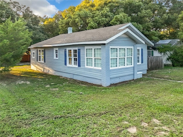 view of home's exterior featuring a yard