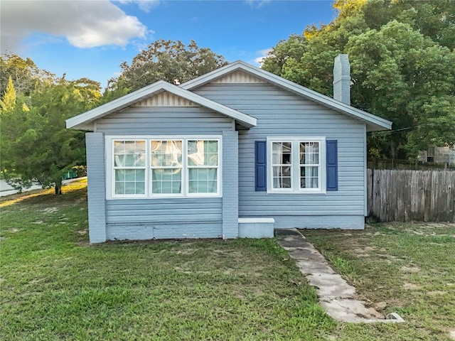 view of home's exterior featuring a lawn