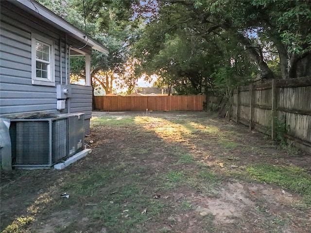 view of yard featuring central AC unit