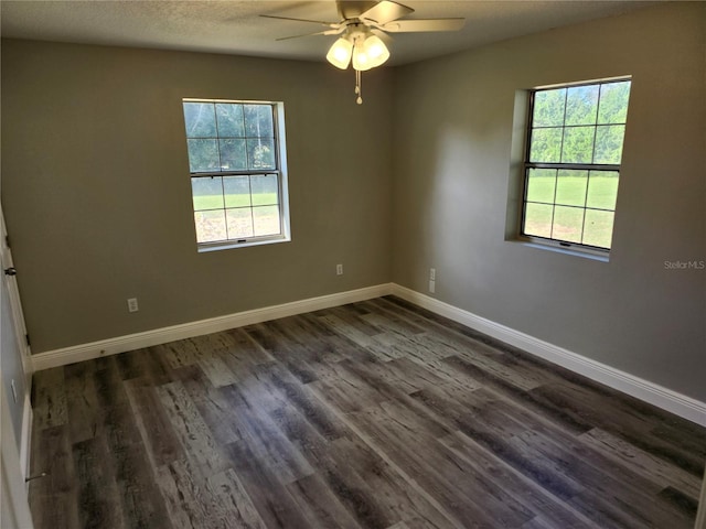 unfurnished room featuring a textured ceiling, dark hardwood / wood-style flooring, and ceiling fan