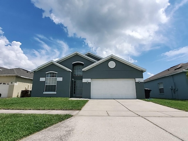 view of front facade with a garage and a front lawn