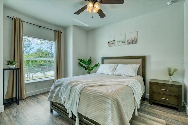 bedroom featuring ceiling fan and light wood-type flooring