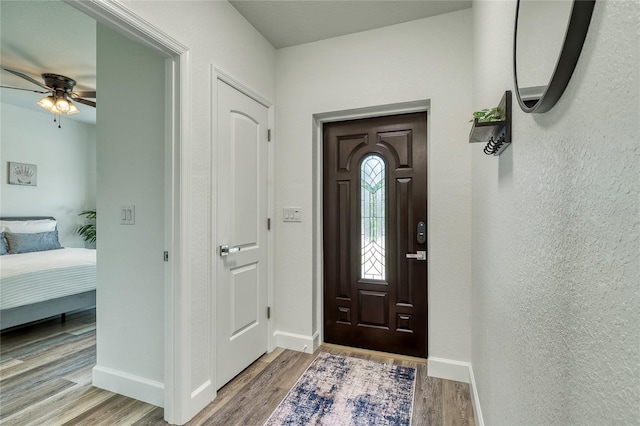 entryway featuring ceiling fan and hardwood / wood-style flooring