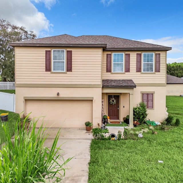 view of front of property featuring a garage and a front yard