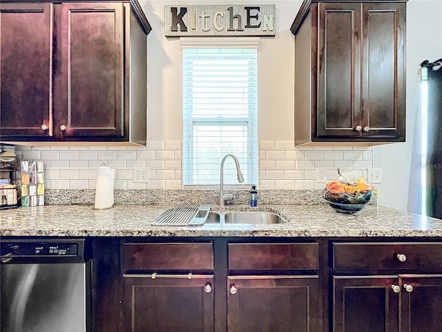 kitchen with dishwasher, tasteful backsplash, and sink