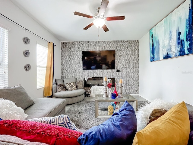 living room with wood-type flooring and ceiling fan