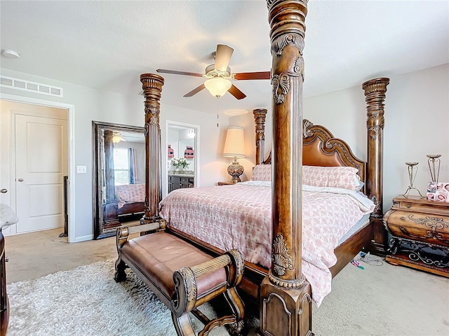 carpeted bedroom featuring ensuite bath and ceiling fan