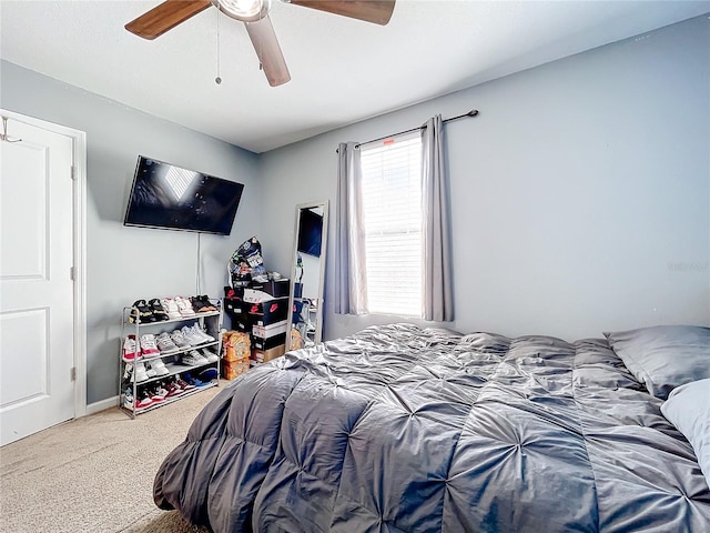 bedroom with ceiling fan and carpet floors