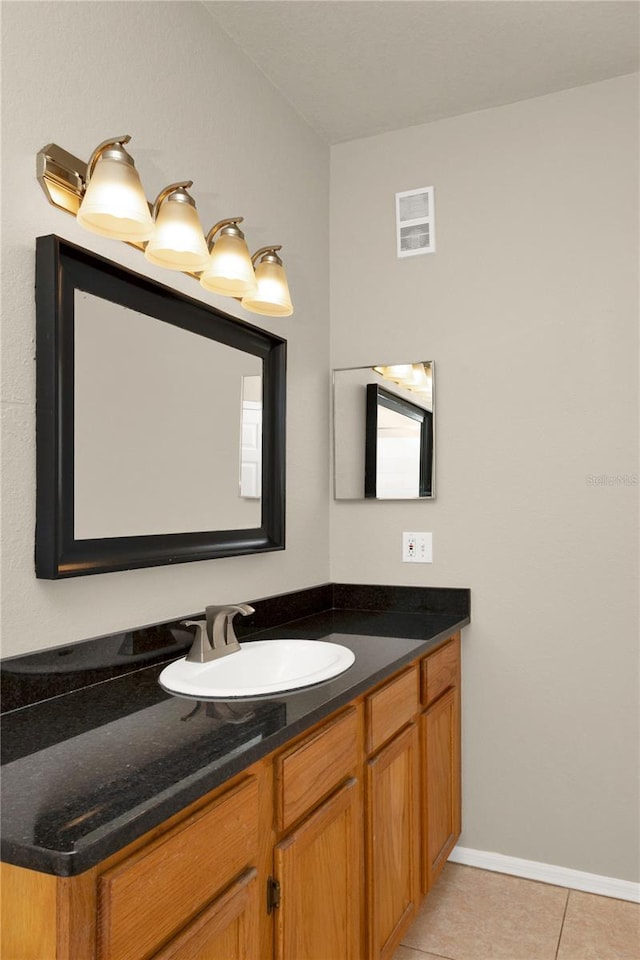 bathroom with tile patterned flooring and vanity