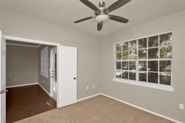 empty room featuring ceiling fan and hardwood / wood-style flooring